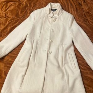 Elegant white DKNY empire waist coat.